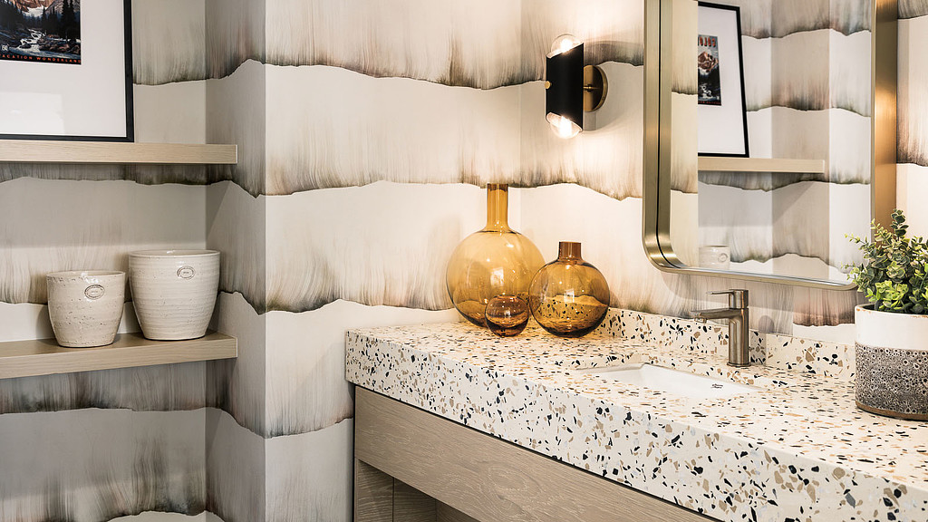 A bathroom with a marble countertop.
